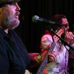 Drei Musiker in einer Reihe