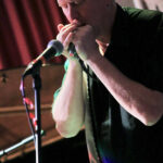 Roger C. Wade (vocals, harmonicas)