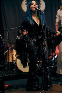 Greta Valenti (lead vocals, percussion)