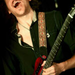 Henry James (electric guitar, background vocals)