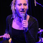 Tina Jobson (vocals, percussion)