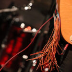 Fransen am Gitarrengurt