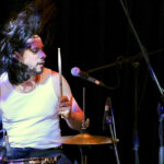 Tommy Arch (drums, acoustic vocals, backing vocals)