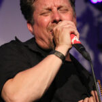 Richard Koster (vocals. harmonica)