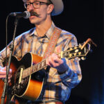 Tobin Kirk (vocals, acoustic guitar)