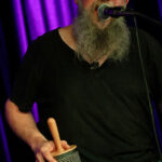 Rob Collins (vocals, harmonica, percussion)