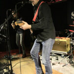 Uli Schrickel (vocals, guitar, harmonica, percussion)