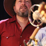 Jason Serious (lead vocals, acoustic guitar, harmonica, percussion, backing vocals)