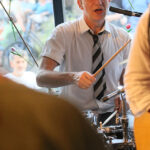Martell Beigang (drums, backing vocals)